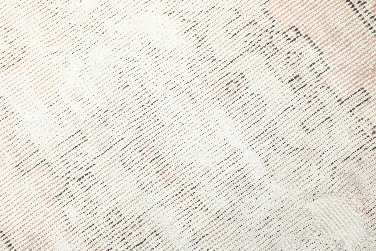 Detailed close-up showing the low wool pile and hand-knotted texture of the rug