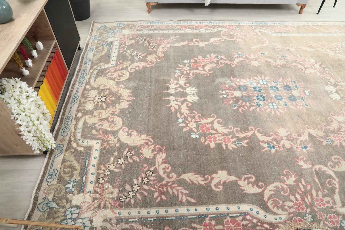 Wide angled shot of the Gray Rose Medallion Anatolian Rug, showing the full length and width.