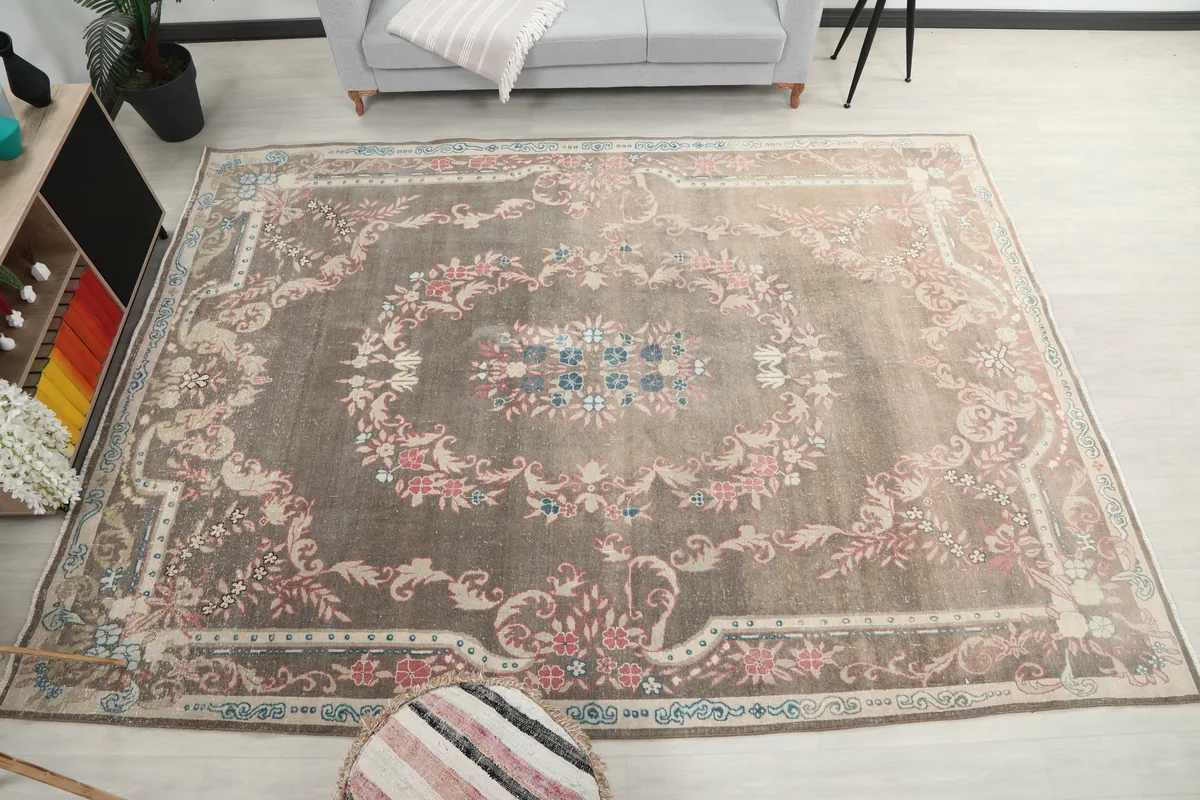 Gray Rose Medallion Anatolian Rug in a room, offering a full perspective of its large size and decorative impact.