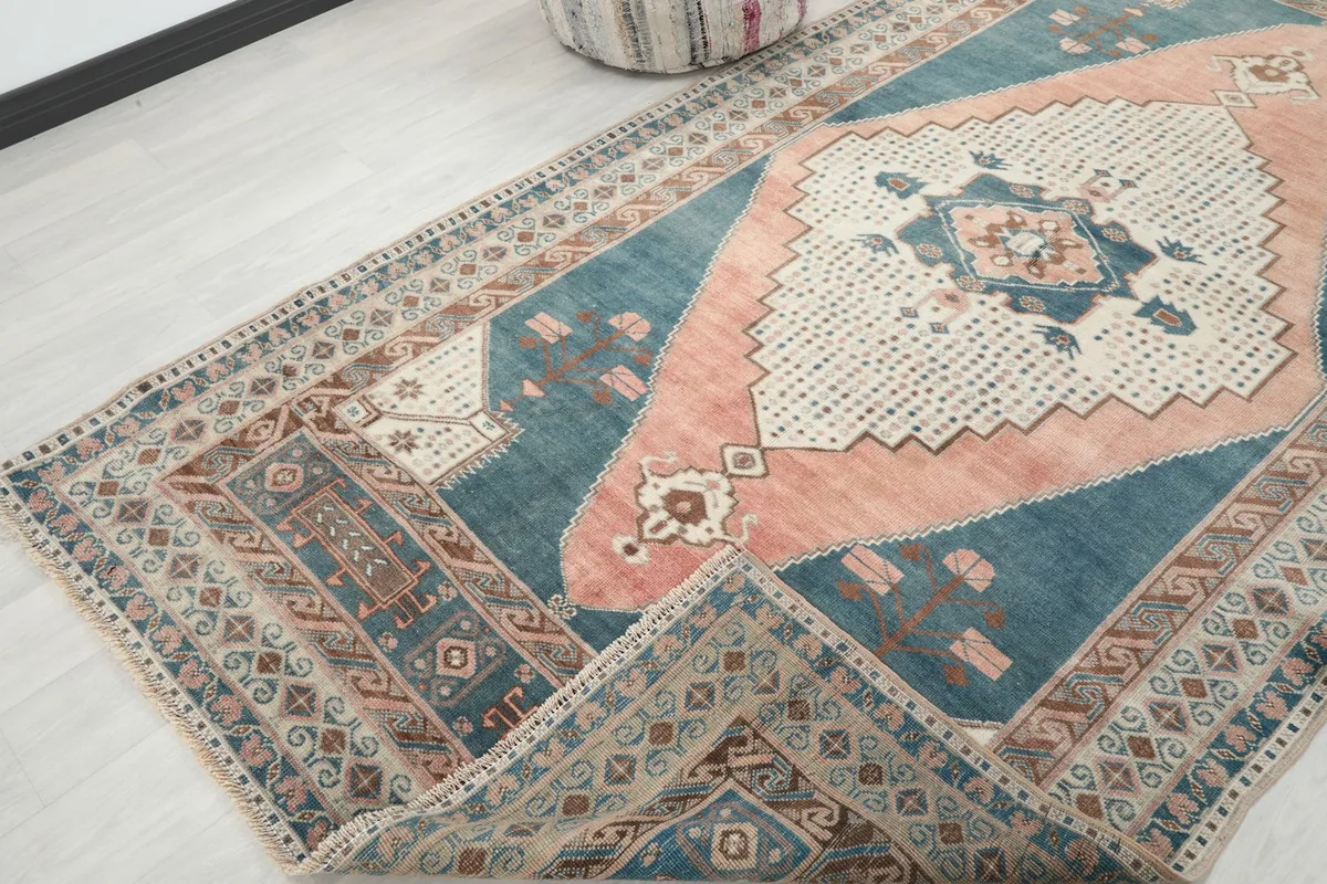 Rug corner folded back to show the reverse side and the hand-knotted construction