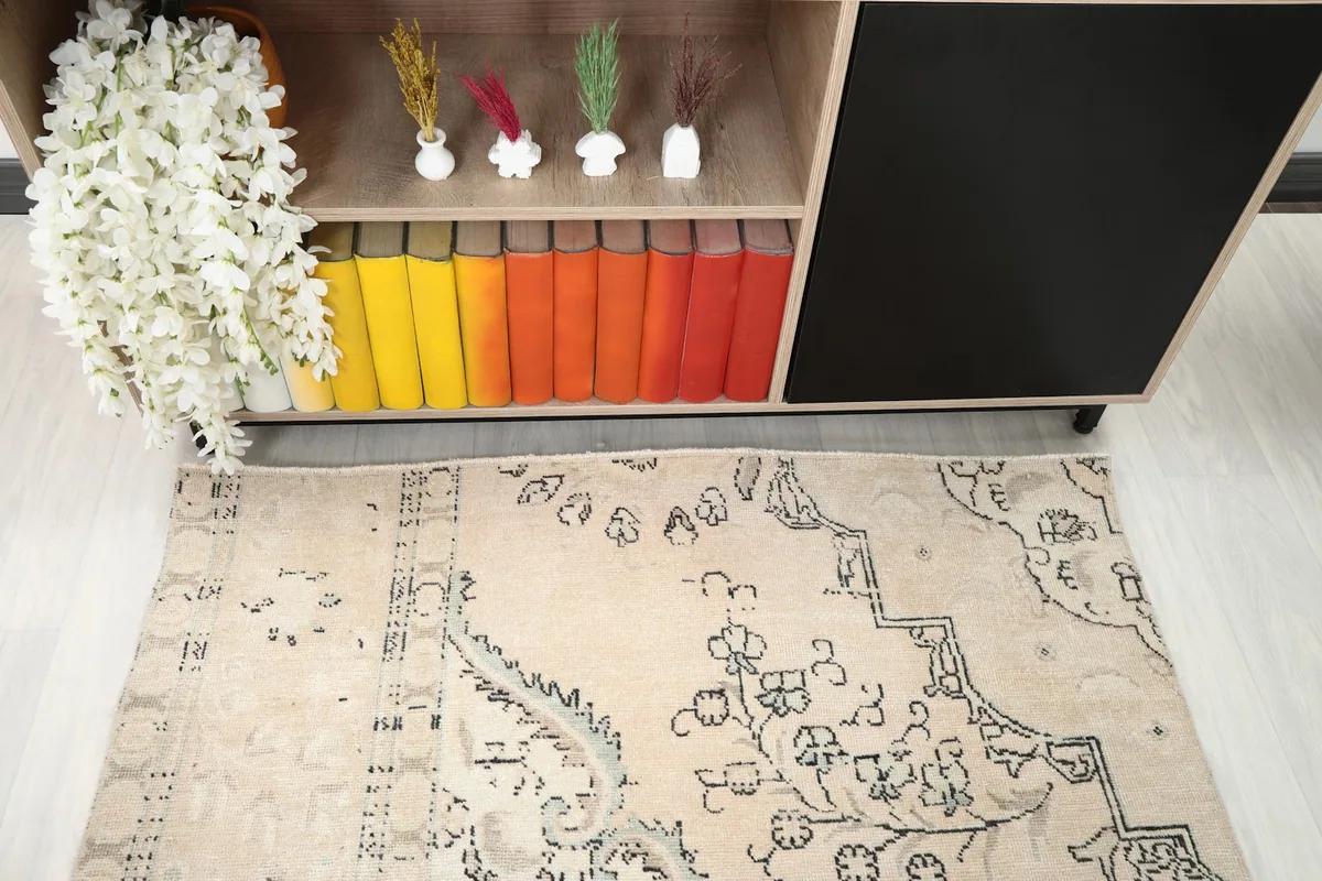 Overhead shot of the rug showing a section of the floral and geometric pattern