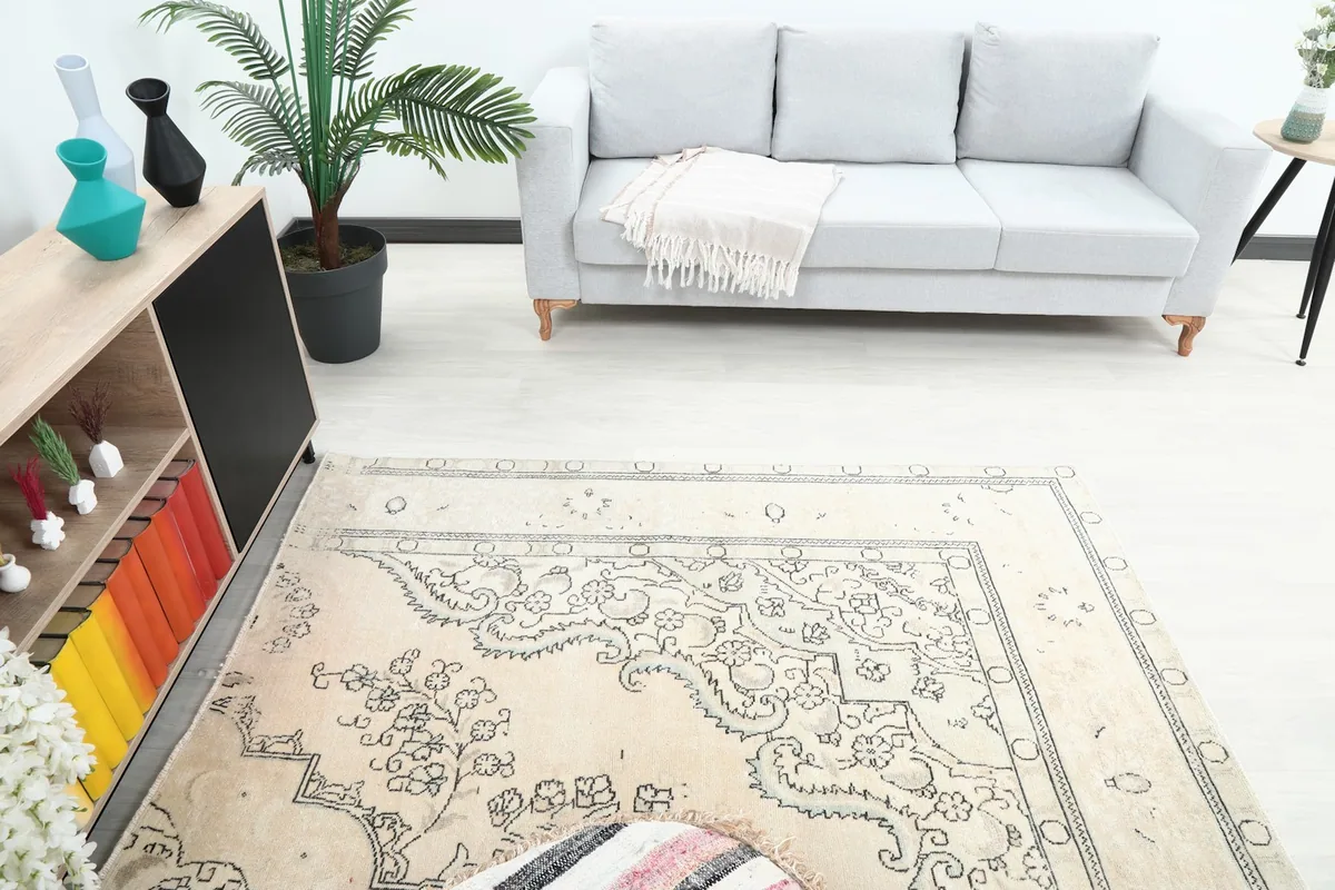 Overhead view of the rug in a living room, highlighting its size relative to furniture