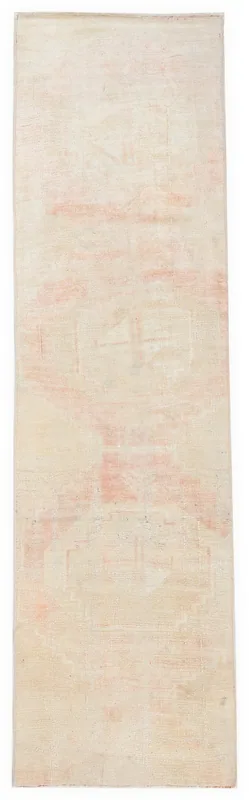 Full top view of the 2'5" x 8'7" vintage Anatolian runner rug with cream and rose tones