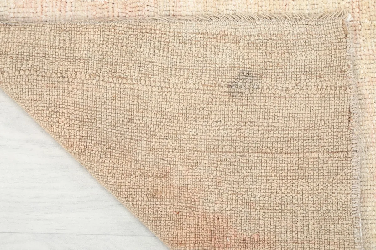 Underside of the runner rug, revealing the tightly woven cotton foundation