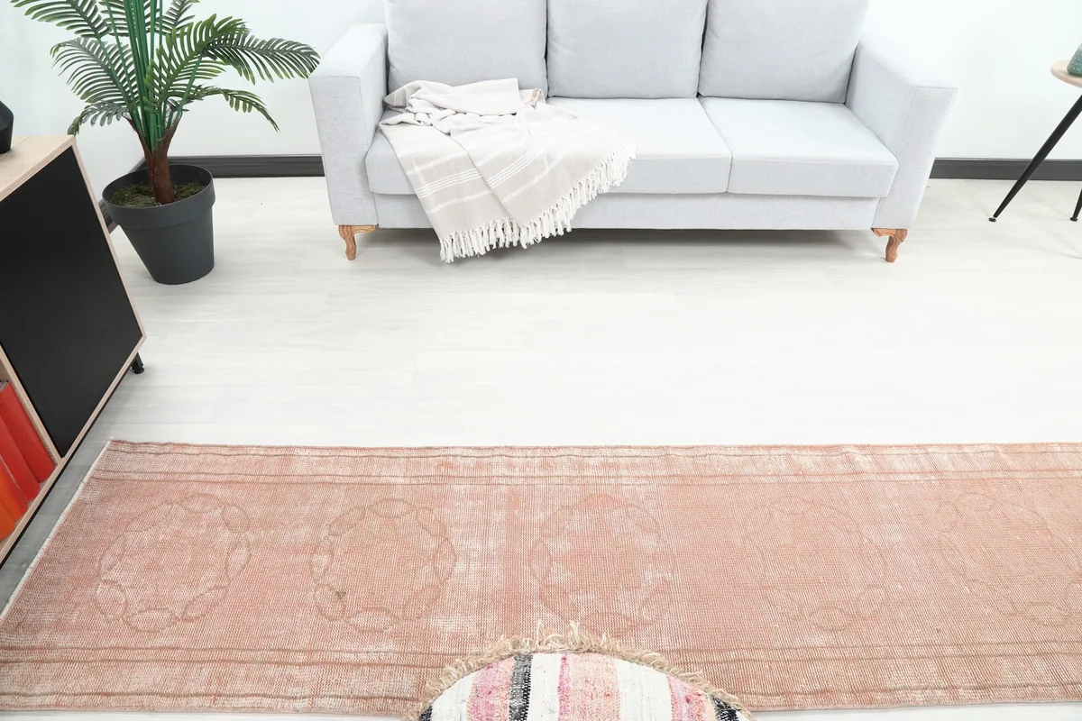 Overhead view of the rose runner rug in a room, highlighting its geometric patterns