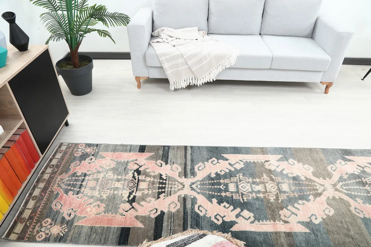 Overhead view of the runner rug in a room, showing its full design and placement near a sofa.