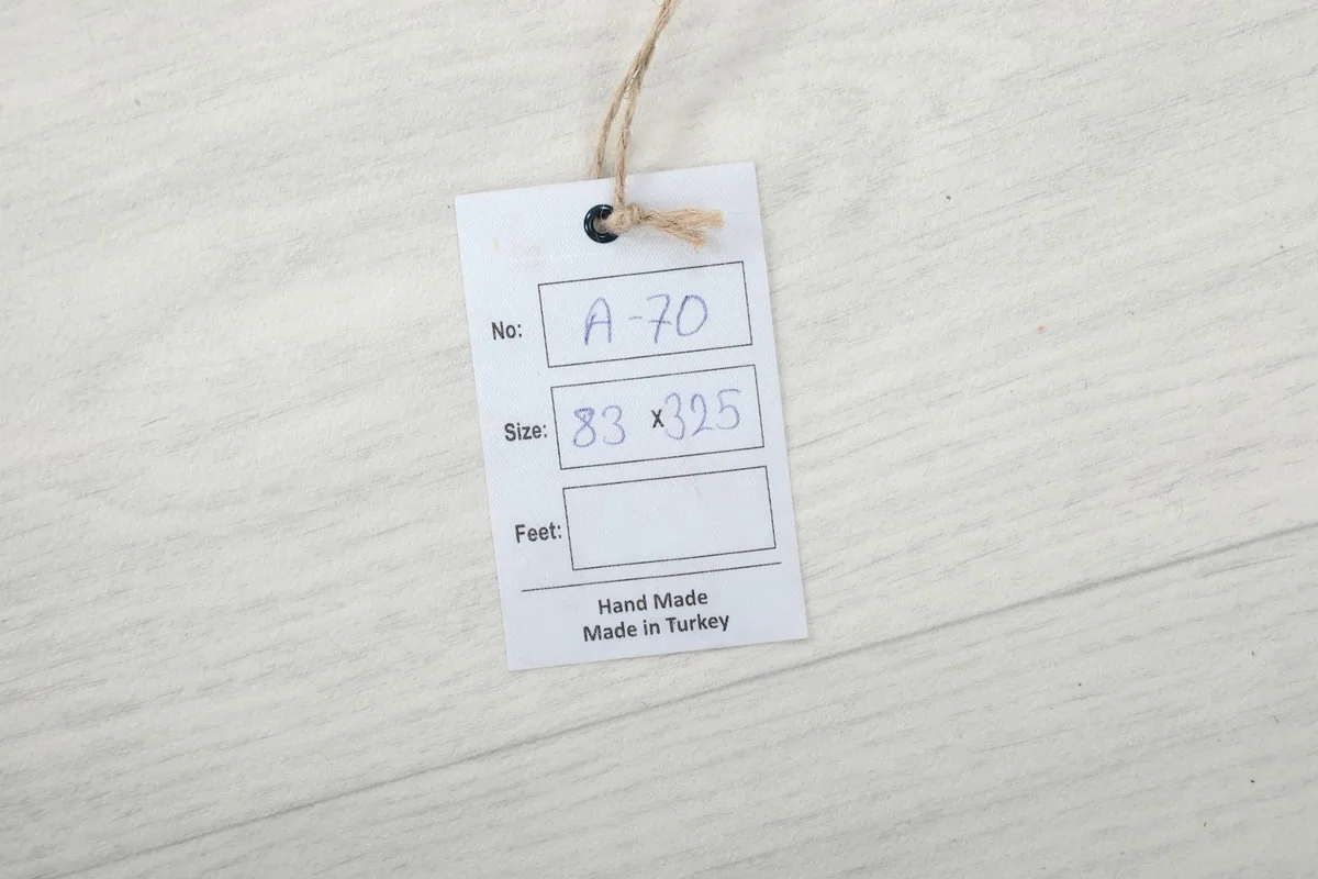 Product tag indicating 'Hand Made in Turkey' and the size '83 x 325 cm'.
