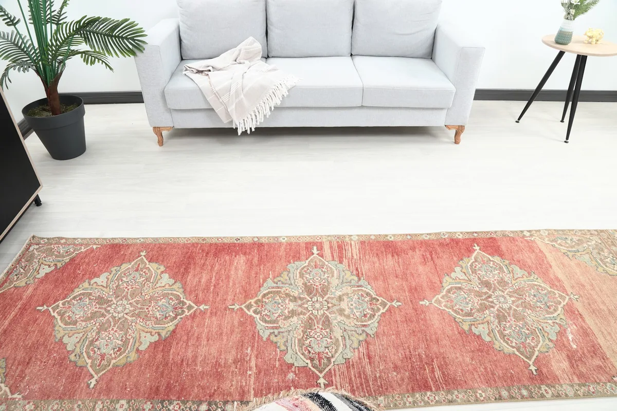 Overhead perspective of the runner rug in the room, highlighting its length and medallions