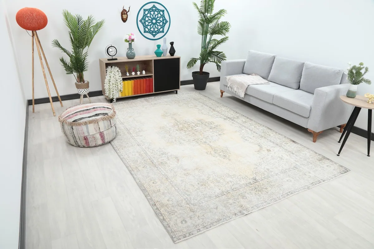 Angle view of the beige Anatolian rug laid out in a modern living space.