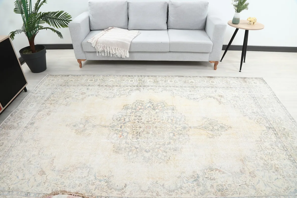 Overhead view of the rug in a room, showing its placement relative to a sofa.