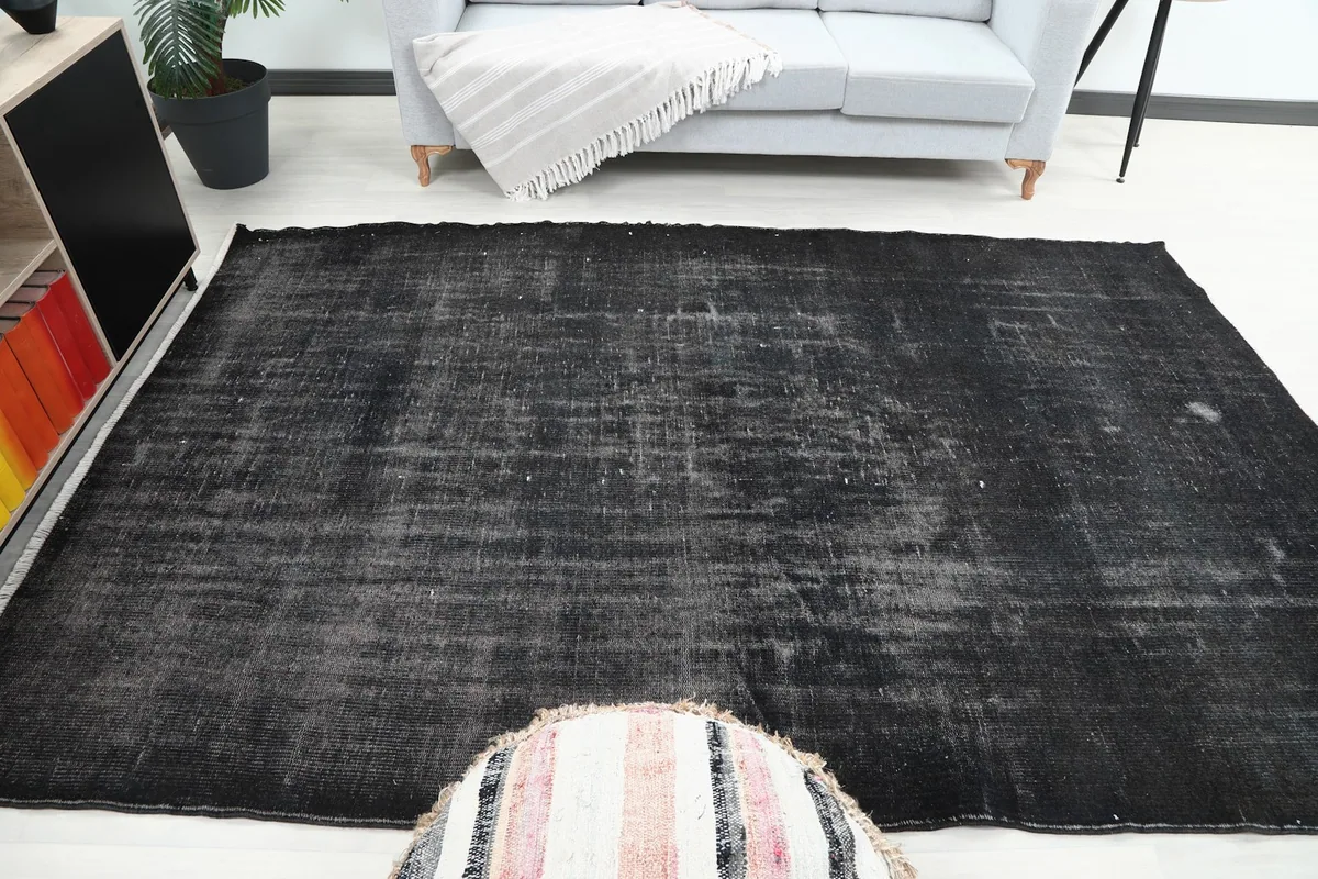 View of the rug in a living area, demonstrating its suitability for various furniture arrangements.