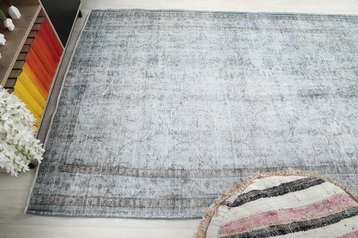 Wide-angle view of the rug on a light floor, showing its placement in a room