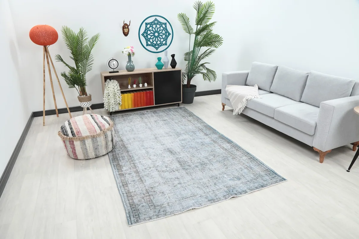 Overhead angle of the blue and gray distressed rug in a modern living space
