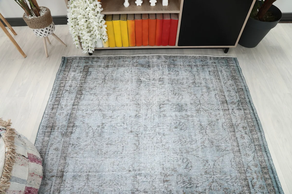 Overhead view of the vintage rug, emphasizing its overall color and design