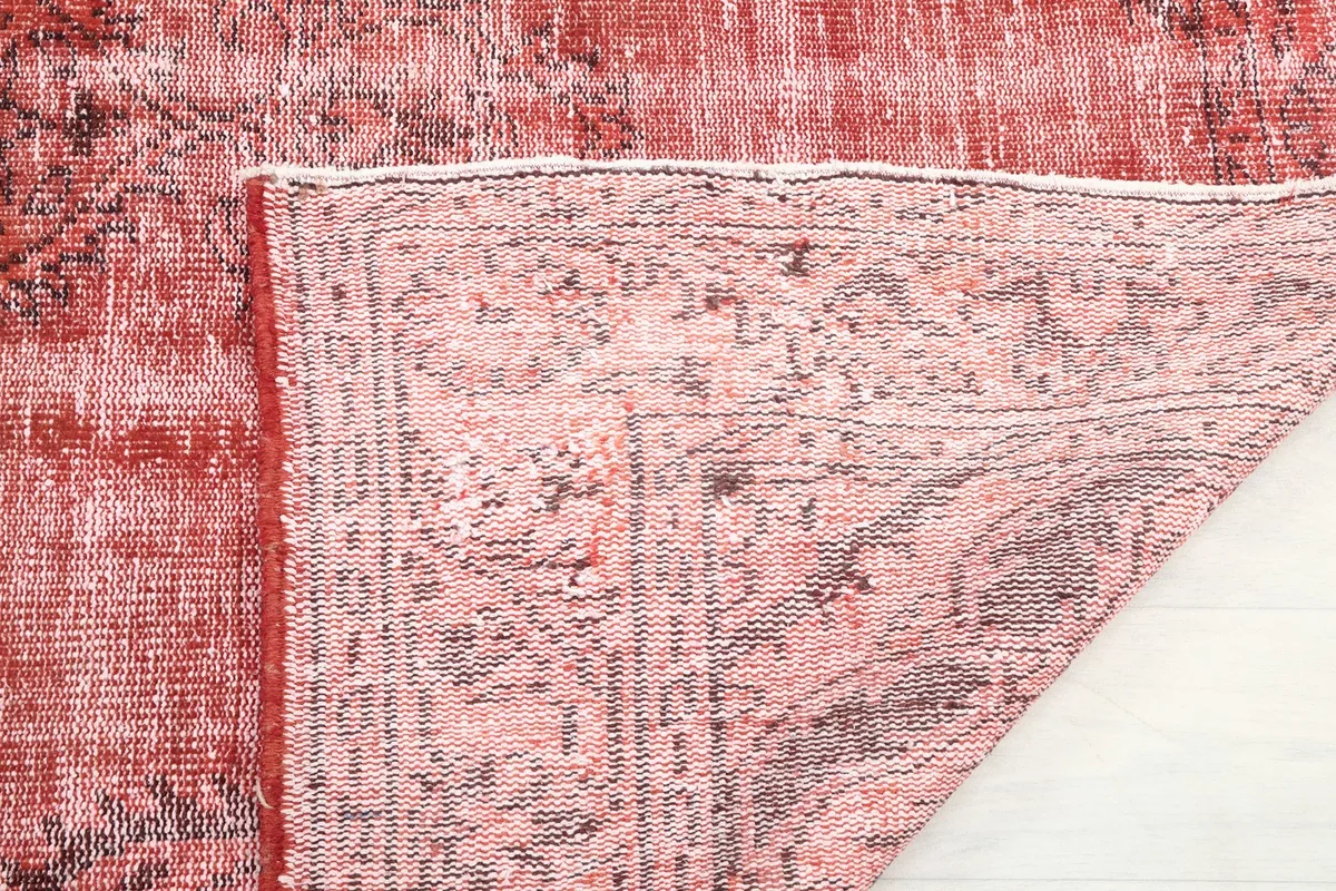 Close-up of the rug's reverse side, showing the intricate hand-knotting