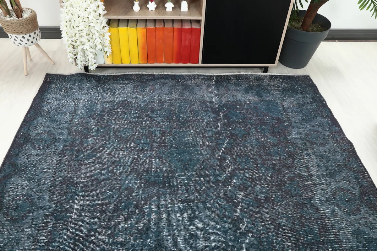 Overhead view of the rug in a room, showcasing its placement relative to furniture and decor.