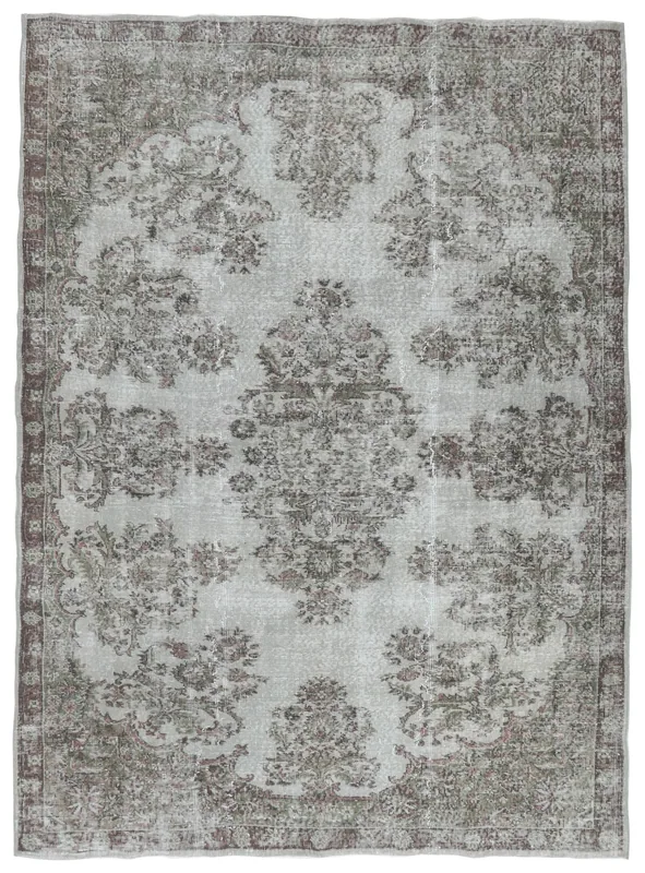 Full overhead view of the vintage gray floral medallion rug on a white background