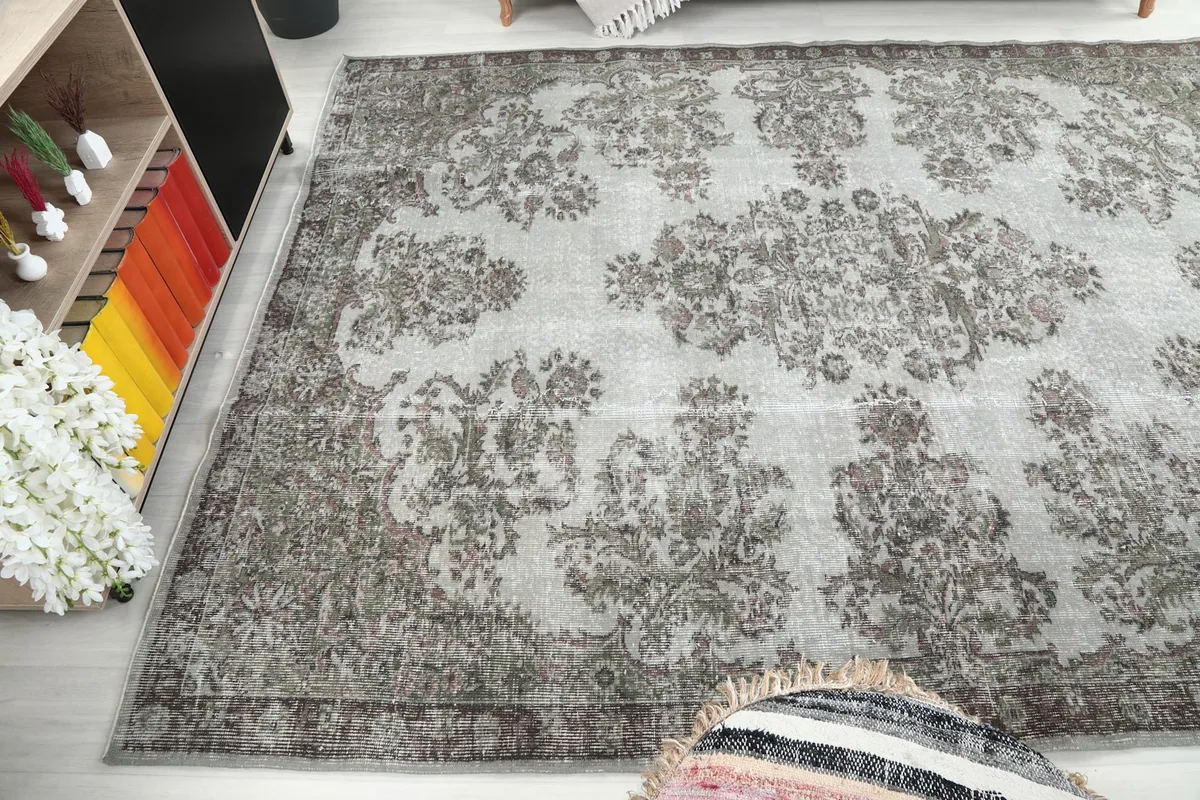 Wide-angle view capturing the rug's presence in the room, with a glimpse of the surrounding decor