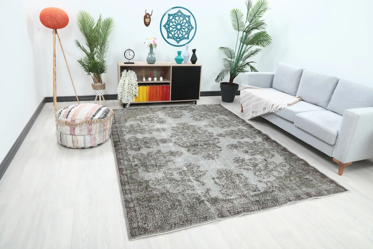 Angle view of the gray floral rug complementing a contemporary living space with minimalist decor