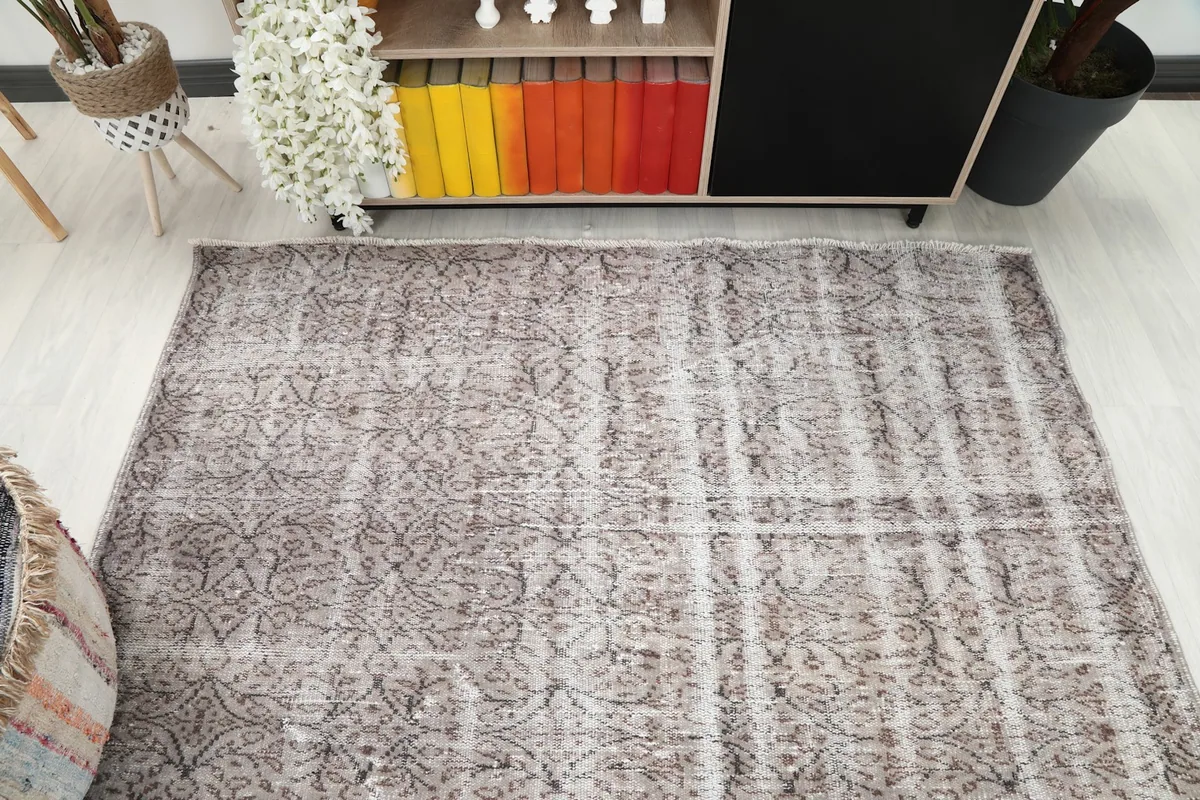Overhead angle of the rug from one end, showing the full width and faded design.