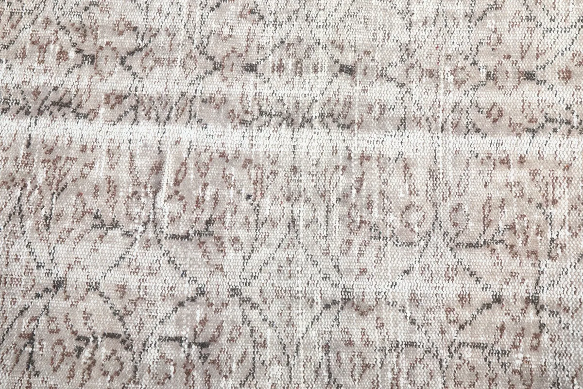 Intricate detail of the hand-knotted patterns and texture of the wool pile.