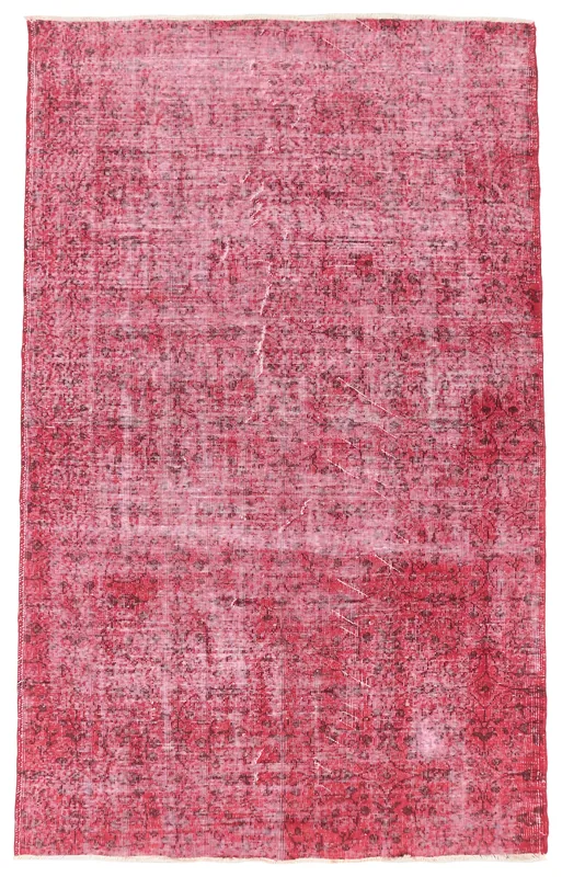 Full overhead view of the 5'1" x 8'4" rose distressed vintage rug on a white background.