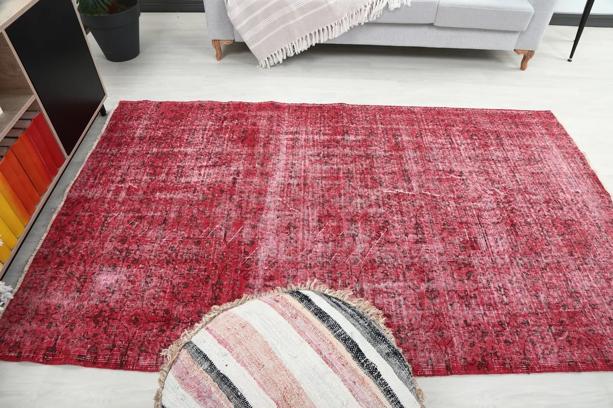 Full room view of the rose rug, showing its presence and how it complements the furniture.