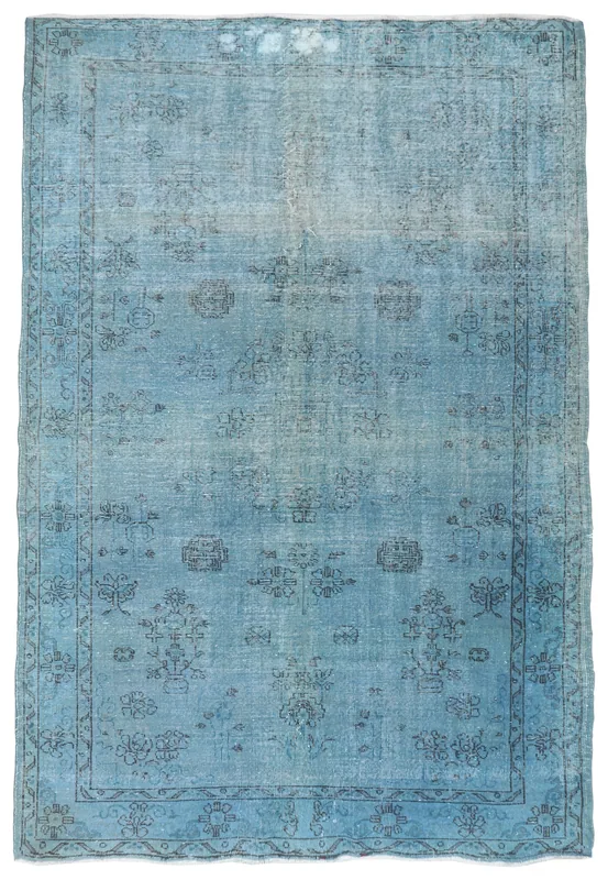 Full overhead view of the 6'5" x 9'5" blue geometric vintage rug on a white background