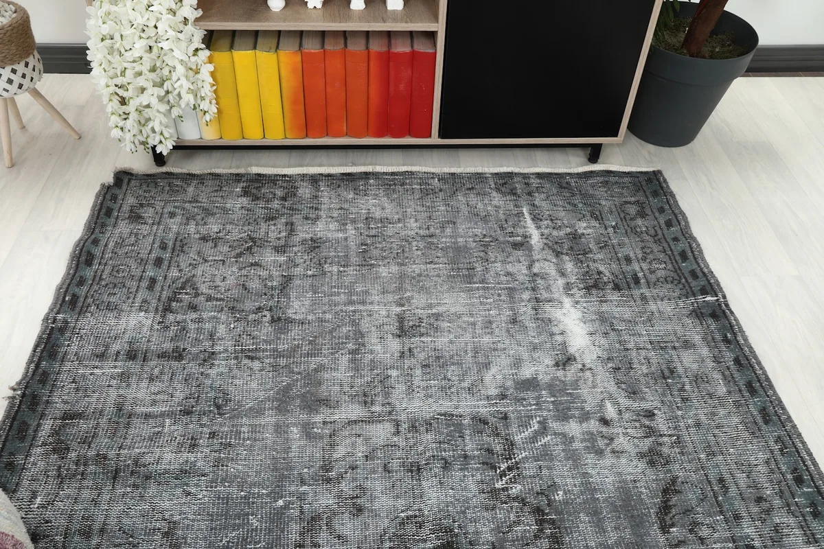 Overhead view of the rug in a living room, showcasing its full design and size