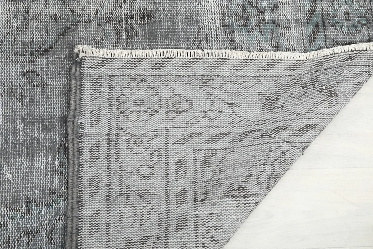 Detailed view of the reverse side of the rug, revealing the intricate knotting of the foundation