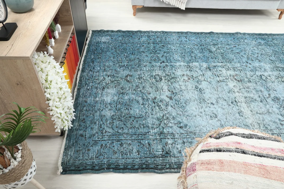 Angle shot of the rug in a room, showing its length and how it complements the decor.