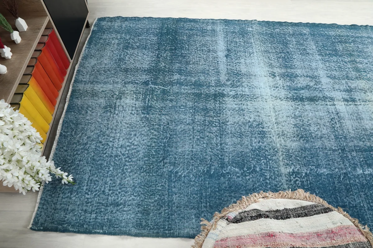 Wide angled view of the rug, showing its placement in the room and interaction with light.