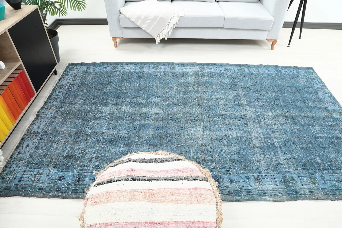 Full room view of the blue vintage rug, showcasing its size and impact in a living area
