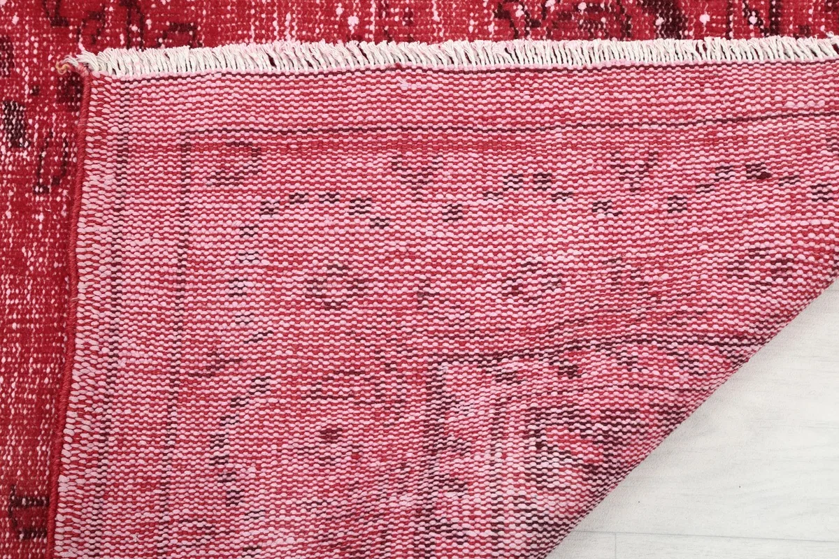 Underside of the rug revealing the hand-knotted cotton foundation