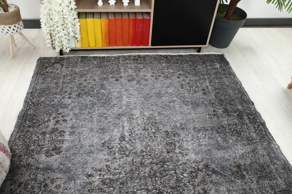 Overhead view of the rug in a room setting, showing its placement near a cabinet