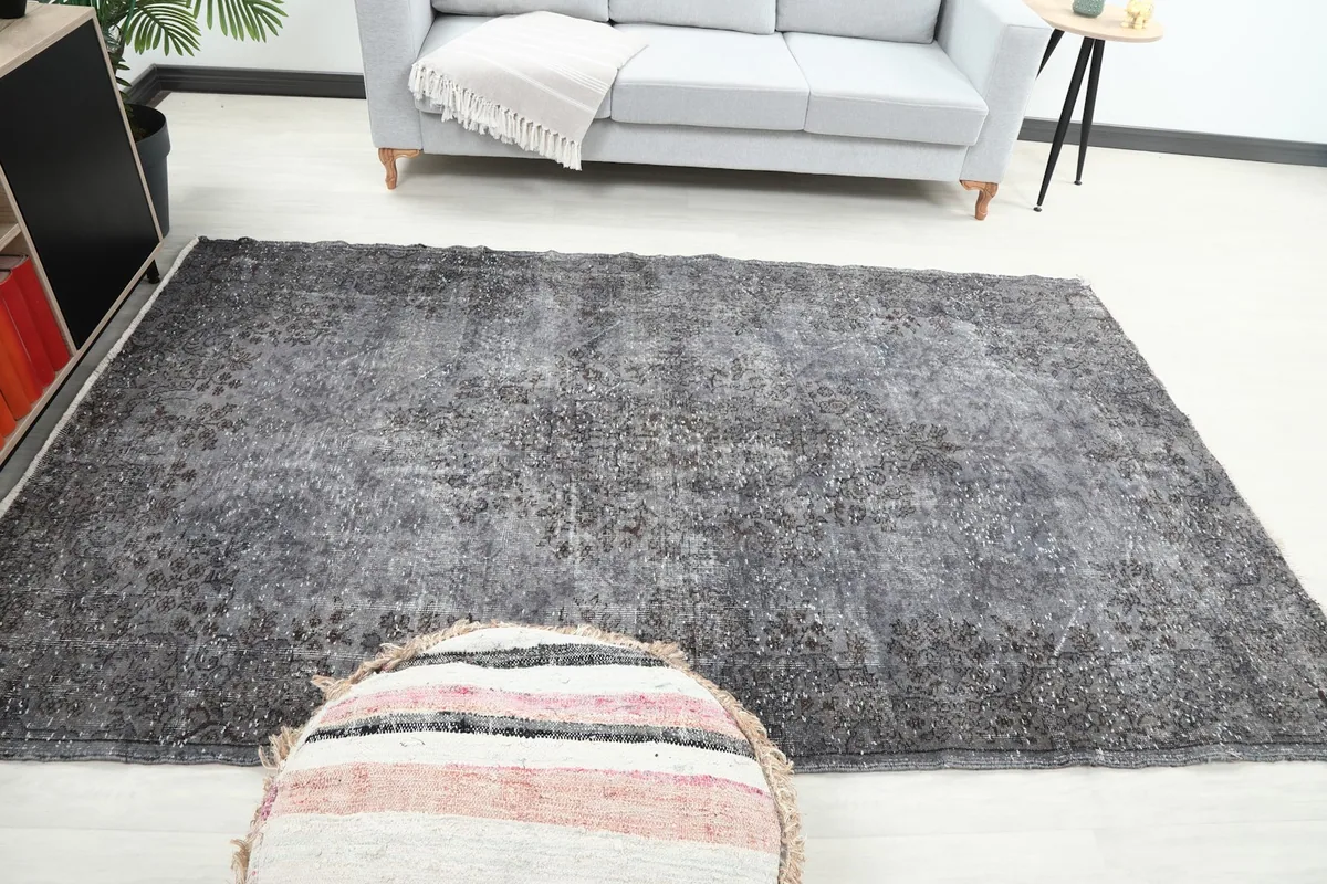 Full room view of the gray vintage rug, showcasing its presence and scale