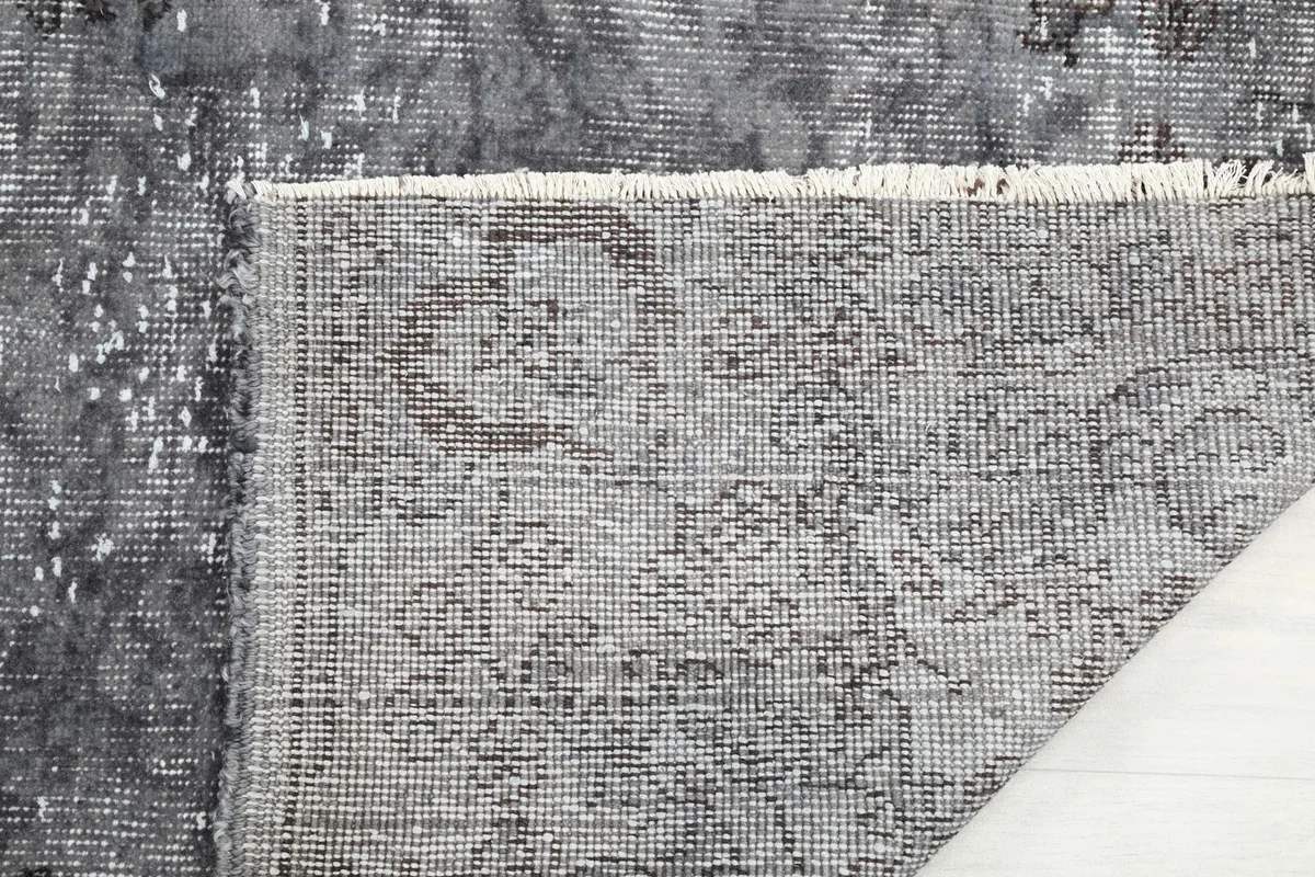Detailed view of the rug's reverse side, showing the hand-knotted construction