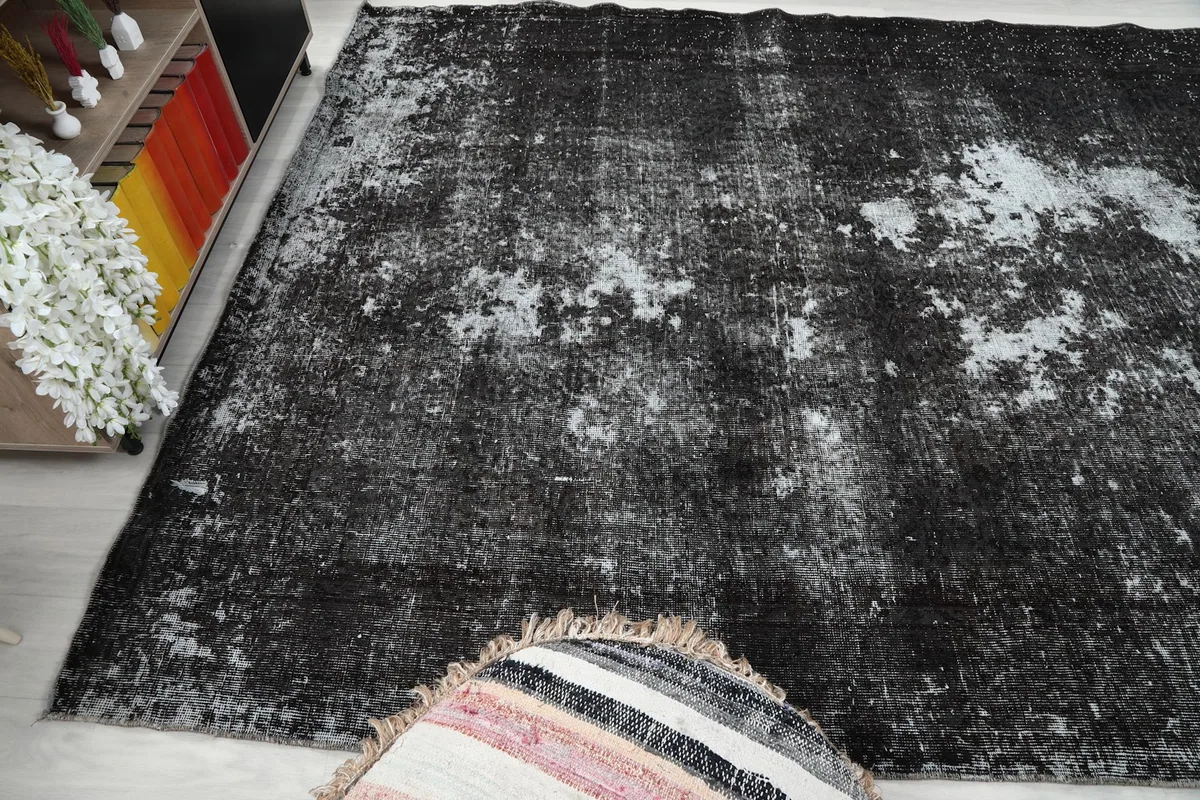 Another angle of the rug in a room, highlighting its large size and color variation