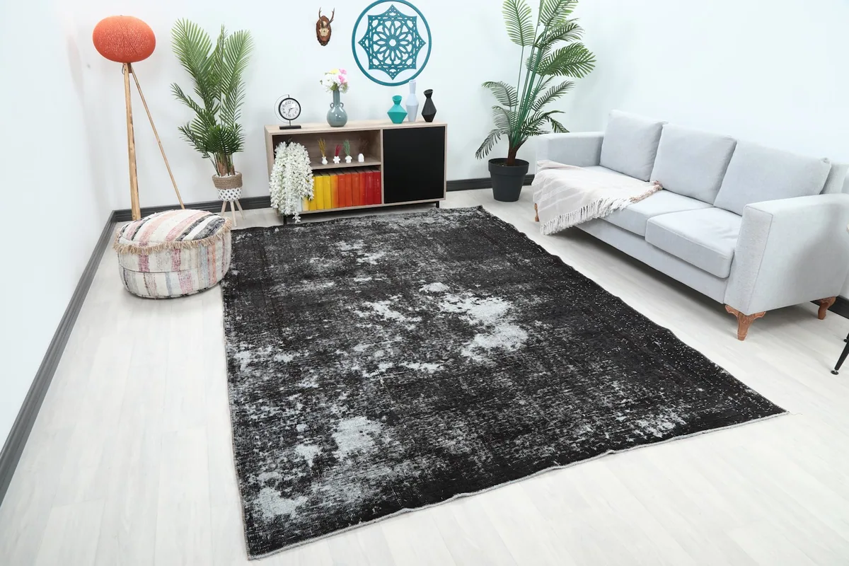 Angle view of the large charcoal and gray rug in a modern living space