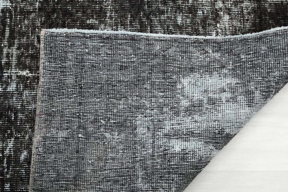 Close-up of the rug's low pile and the texture of the hand-knotted wool