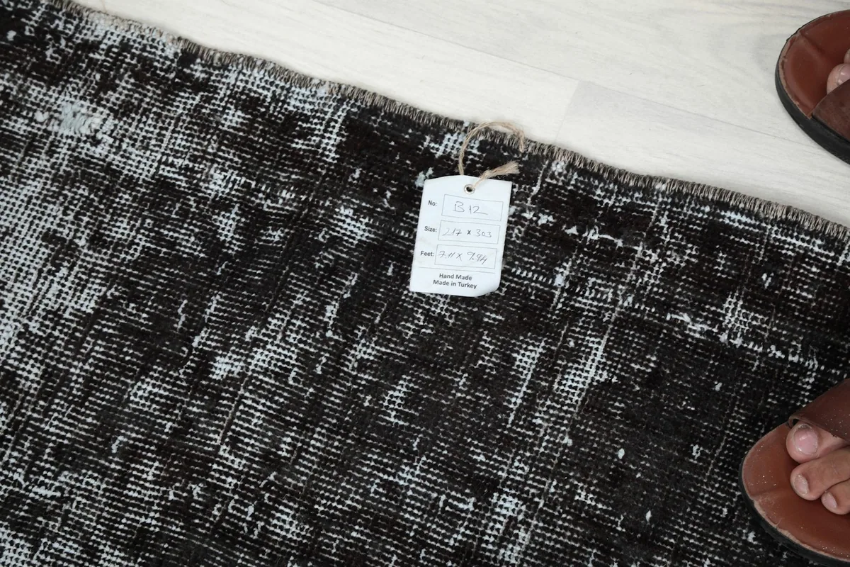 Label attached to the rug's edge, showing product information and origin