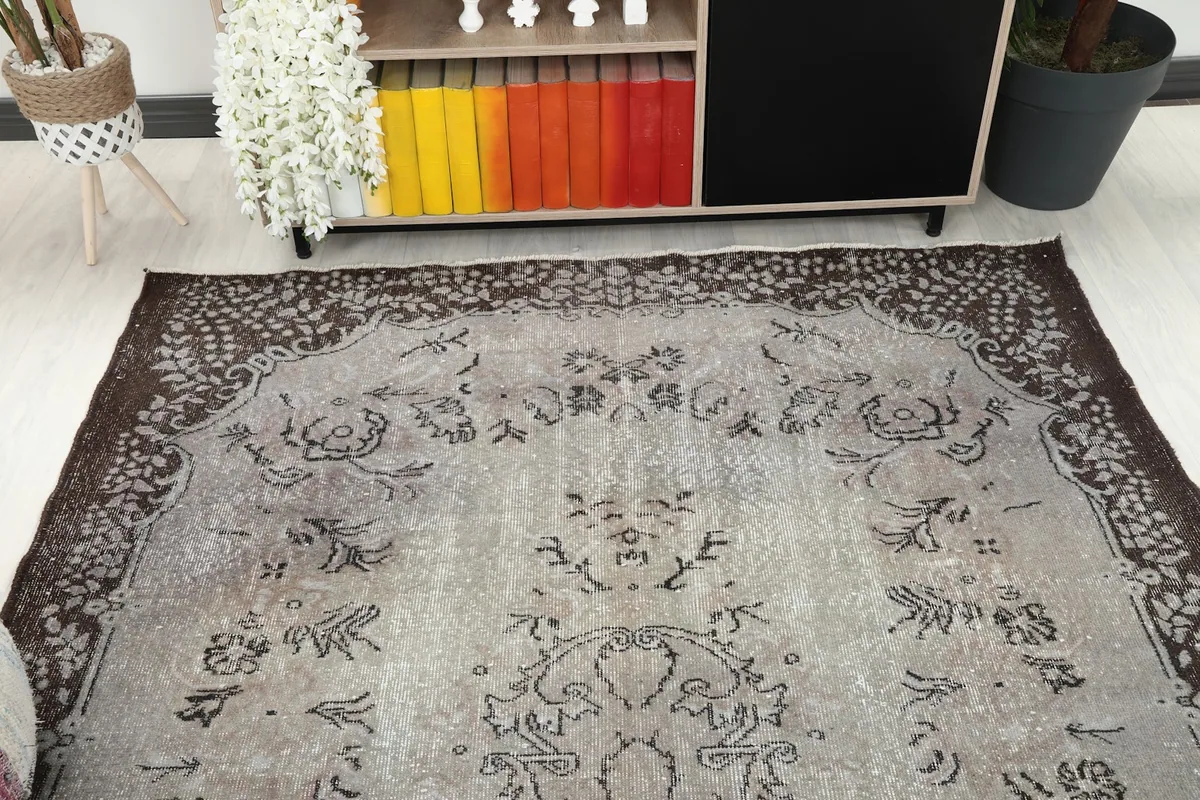 Overhead angle view capturing the full design and colors of the vintage wool rug