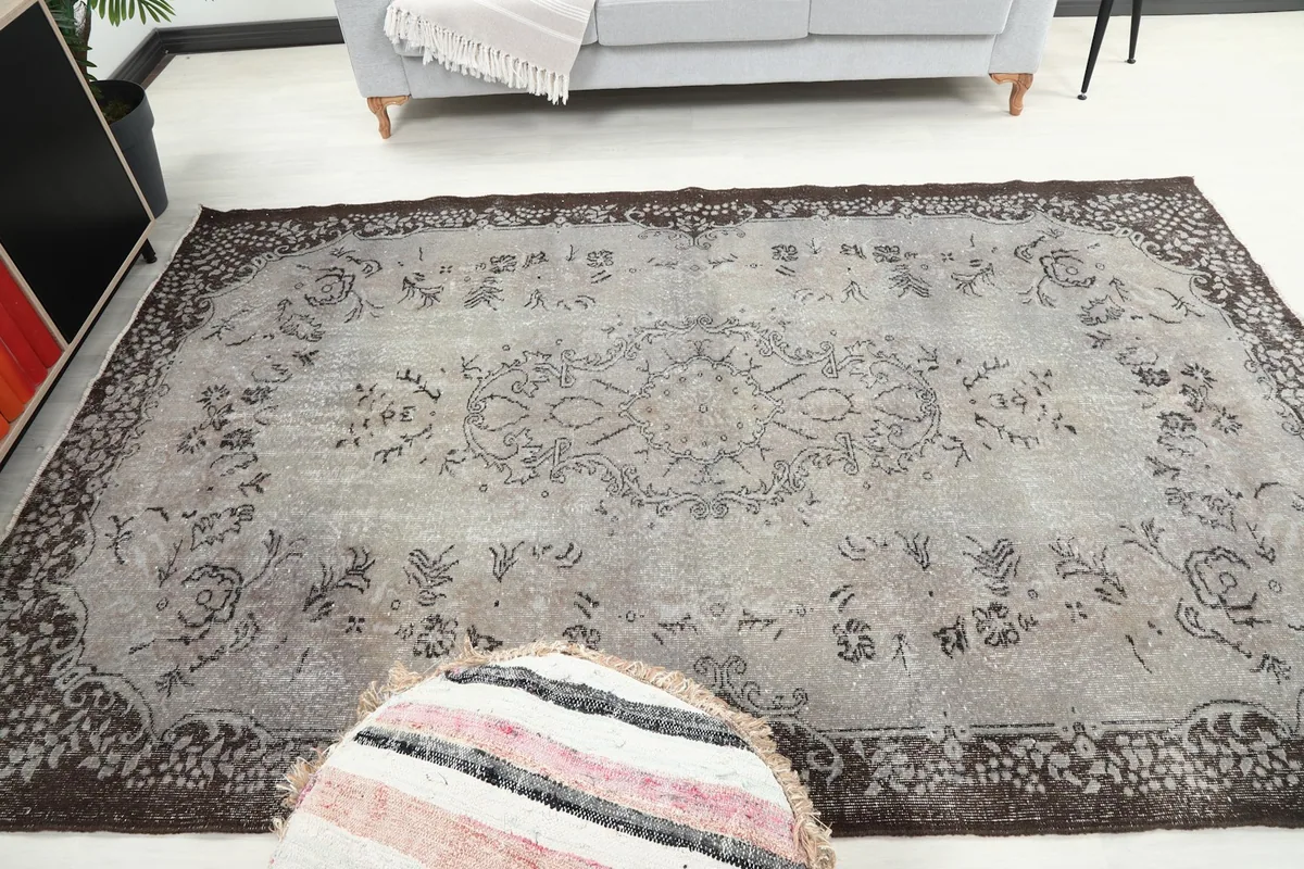 Full overhead view of the gray and brown vintage Anatolian rug in a room setting