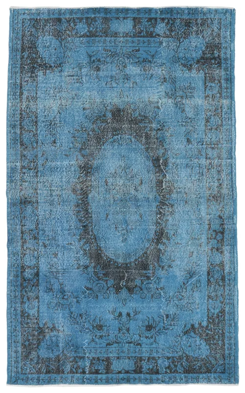 Full top view of the 5'7" x 9'8" blue and charcoal vintage Anatolian area rug on a white background