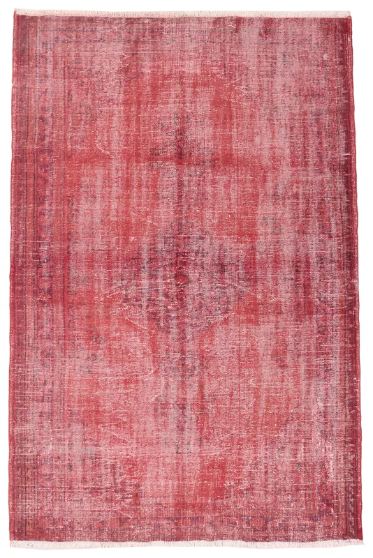 Full overhead view of the red distressed vintage Anatolian area rug on a white background