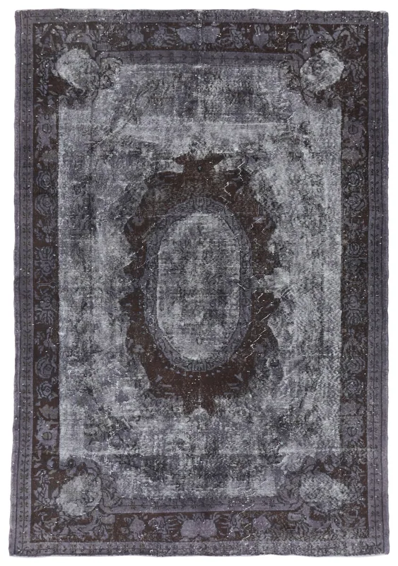 Full overhead view of the charcoal and brown vintage Anatolian rug