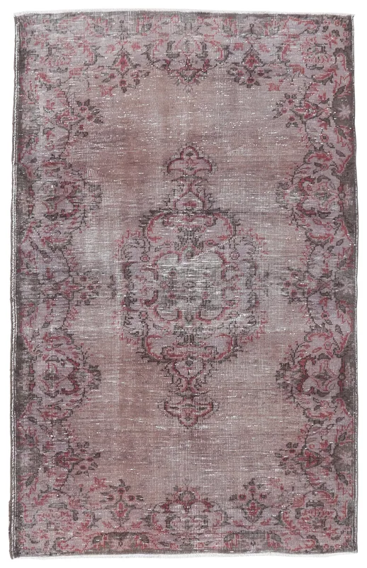 Full overhead view of the 4'11" x 8'0" vintage Anatolian rug with a brown field and rose medallion