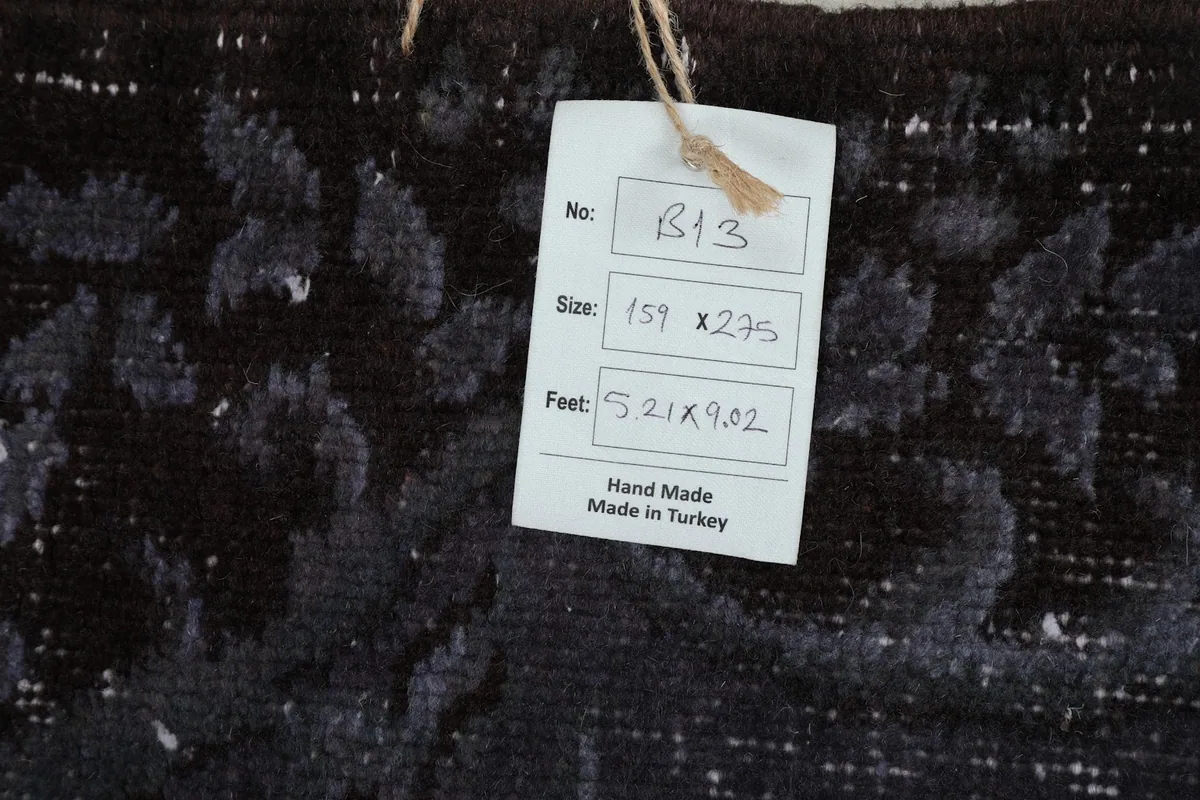 Detail of the rug's label confirming hand-made origin from Turkey