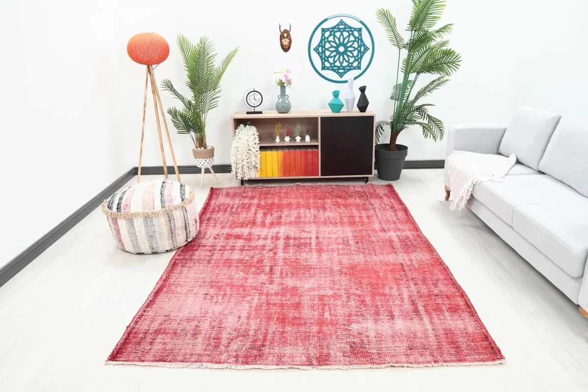 Rose vintage area rug displayed in a living room setting