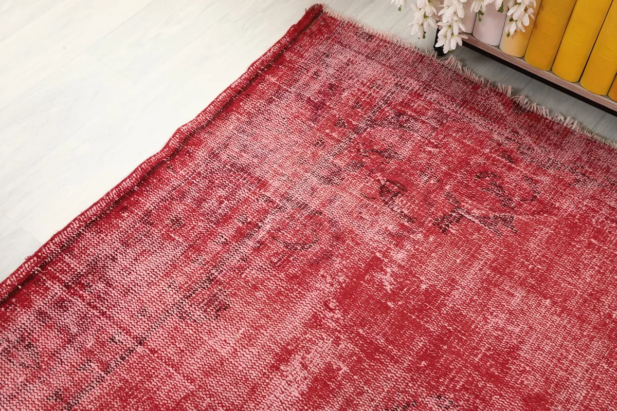 Corner detail of the rose rug, showing the edge and texture